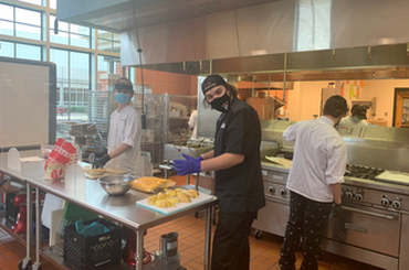 Culinary students cooking up creations for the "Nacho Master Competition."