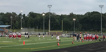 Patriot's football team playing in a game in 2018. Current players and coaches are hopeful for the chance to play this school year.
