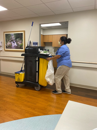 Environmental services worker, Adama Koroma, photo courtesy of Lani Brown