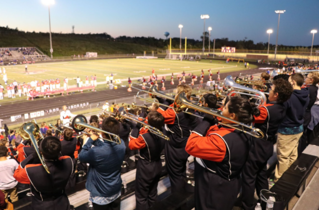 In the image above, The marching pioneers are playing stand tunes.