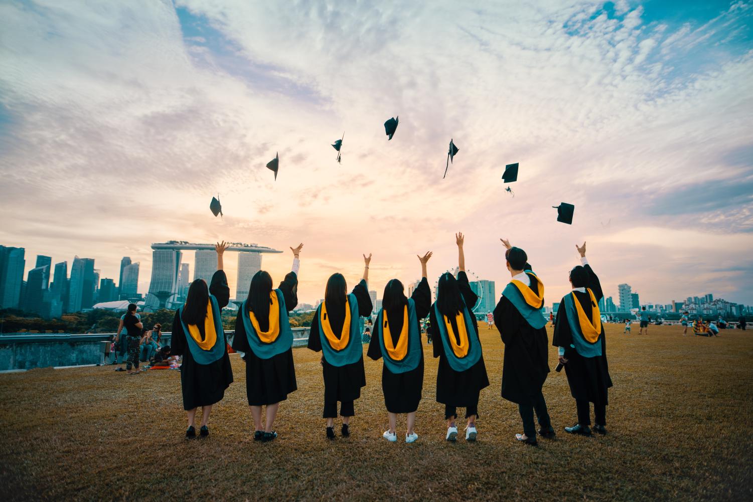 Graduates throw their caps in excitement! Photo by Pang Yuhao on Unsplash