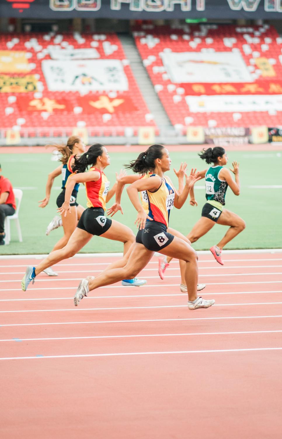 Women running on a track.