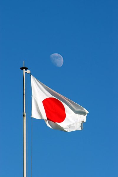 Picture of Japanese flag waving under the moon. Credit: Smooth_O