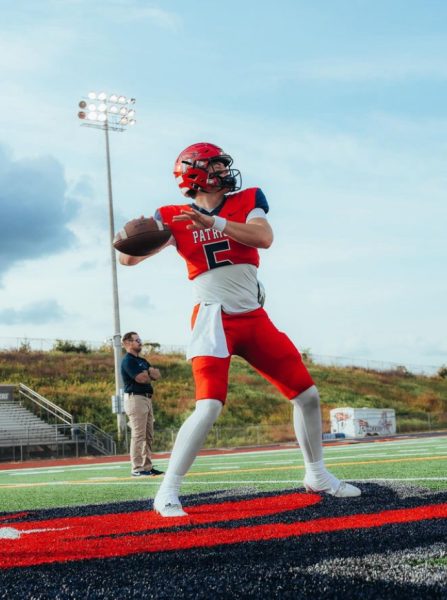 Tyler Knutson ('25) throws a deep ball in preparation for the upcoming game.