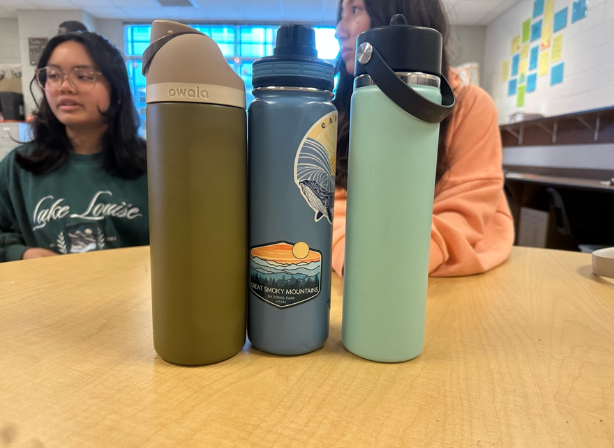 Photo of Patriot High School students water bottles that were bought during different periods of time, each to when they were trending. [Marina Georgy]